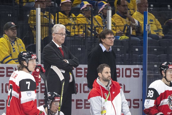 220514 Head coach Roger Bader and assistant coach Arno Del Curto of Austria during the 2022 IIHF Ice hockey, Eishockey World Championship, WM, Weltmeisterschaft game between Sweden and Austria on May  ...