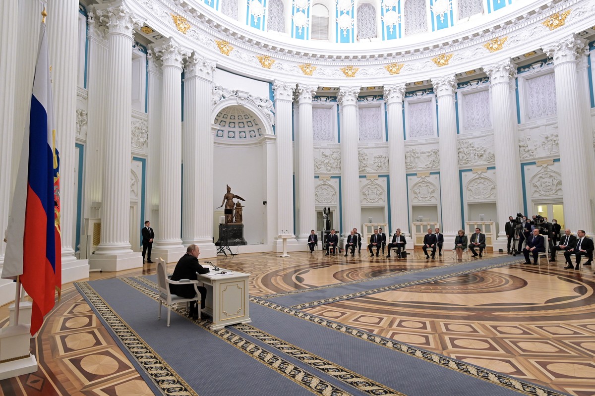 epa09775886 Russian President Vladimir Putin chairs a meeting with members of Russia's Security Council in the Kremlin in Moscow, Russia, 21 February 2022. The meeting focused on the issue of rec ...