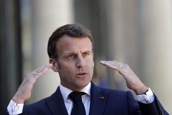 FILE - In this April 27, 2021 file photo, French President Emmanuel Macron delivers a speech prior to a meeting with Republic of Congo's President Felix Tshisekedi, at the Elysee Palace, in Paris ...