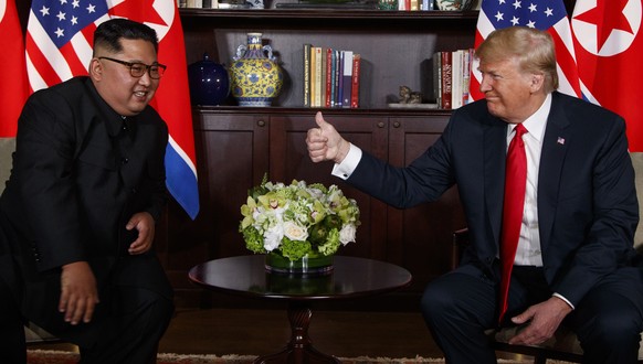 FILE - This June 12, 2018, file photo, U.S. President Donald Trump, right, meets with North Korean leader Kim Jong Un on Sentosa Island, in Singapore. Trump and Kim will likely be all smiles as they s ...