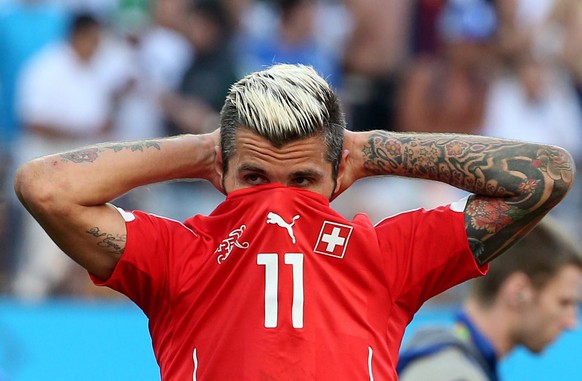 epa04294462 Valon Behrami of Switzerland reacts after losing the FIFA World Cup 2014 round of 16 match between Argentina and Switzerland at the Arena Corinthians in Sao Paulo, Brazil, 01 July 2014. Ar ...