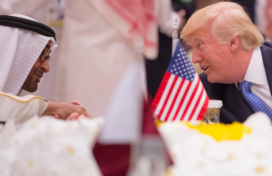 epa05979095 A handout photo made available by the Saudi Press Agency (SPA) shows Crown Prince of Abu Dhabi Mohammed Bin Zayed al-Nahyan talk to US President Donald J. Trump (L) during the opening sess ...