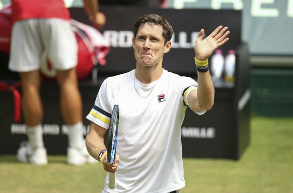 Australia&#039;s Matthew Ebden celebrates after winning against Germany&#039;s Philipp Kohlschreiber in their tennis ATP tournament match in Halle, western Germany, Thursday, June 21, 2018. ( Friso Ge ...