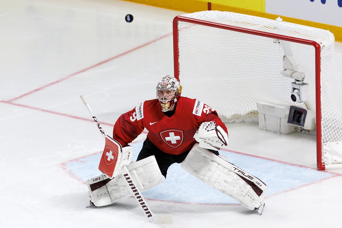 Switzerland's goaltender Robert Mayer looks on the puck, during the IIHF 2023 World Championship preliminary round group B game between Switzerland and Slovakia, at the Riga Arena, in Riga, Latvi ...