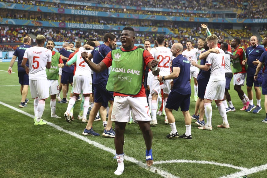 Switzerland's Breel Embolo celebrates end of the Euro 2020 soccer championship round of 16 match between France and Switzerland at the National Arena stadium, in Bucharest, Romania, Tuesday, June ...