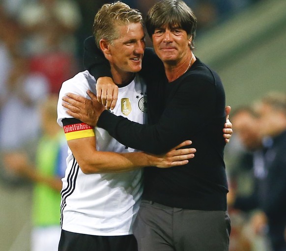 Football Soccer - Germany v Finland - Soccer Friendly - Moenchengladbach, Germany - 31/08/16. Germany&#039;s Bastian Schweinsteiger and coach Joachim Loew during the match REUTERS/Wolfgang Rattay