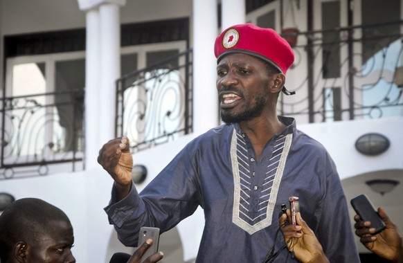 FILE - In this Thursday, May 2, 2019 file photo, Ugandan pop star singer and political opposition activist Bobi Wine, whose real name is Kyagulanyi Ssentamu, greets his followers as he arrives home af ...