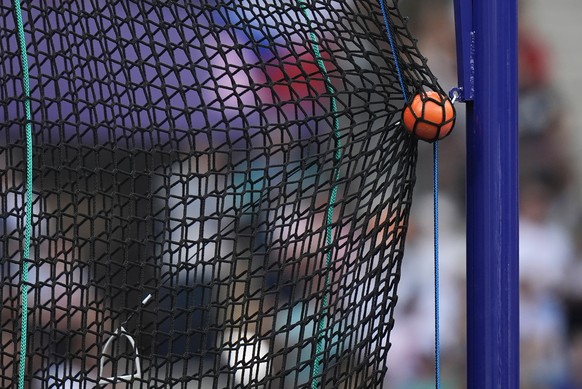 FILE - A hammer is caught by the safety net during the men&#039;s hammer throw qualification at the 2024 Summer Olympics, Aug. 2, 2024, in Saint-Denis, France. (AP Photo/Matthias Schrader, File)