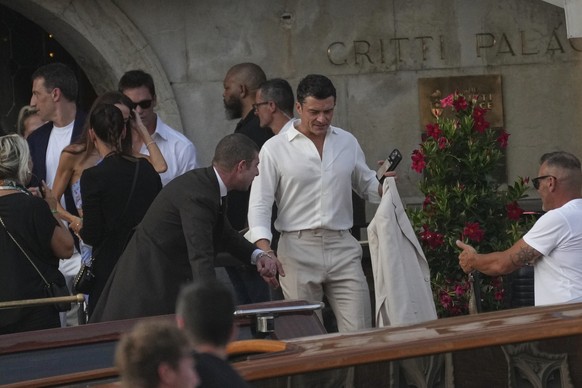 Orlando Bloom, center, leaves a hotel for the pre wedding reception of Amazon founder Jeff Bezos and Lauren Sanchez, in Venice, Italy, Thursday, June 26, 2025. (AP Photo/Antonio Calanni)
Orlando Bloom