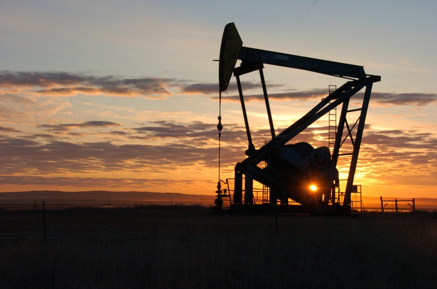 FILE - In this Nov. 6, 2013, file photo, a Whiting Petroleum Co. pump jack pulls crude oil from the Bakken region of the Northern Plains near Bainville, Mont. Oil’s rapid decline in the second half of ...