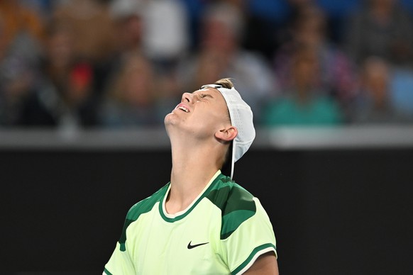 epa11087123 Holger Rune of Denmark grimaces during his 2nd round match against Athur Cazaux of France at the 2024 Australian Open in Melbourne, Australia, 18 January 2024. EPA/LUKAS COCH AUSTRALIA AND ...