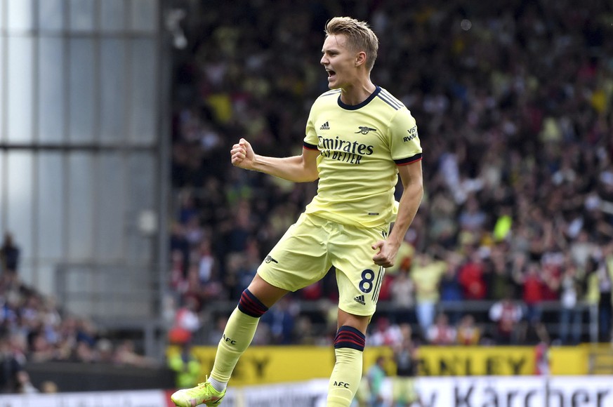 Arsenal&#039;s Martin Odegaard celebrates scoring their side&#039;s first goal of the game against Burnley during their English Premier League soccer match at Turf Moor in Burnley, England, Saturday S ...