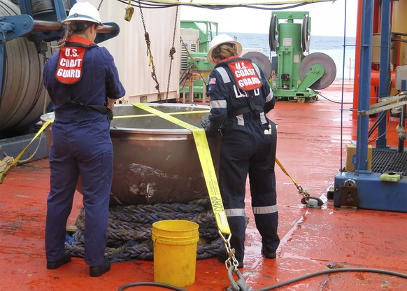 In this photo provided by the U.S. National Transportation Safety Board, U.S. Coast Guard marine safety engineers assigned to the Marine Safety Center in Washington D.C., working for the Marine Board  ...