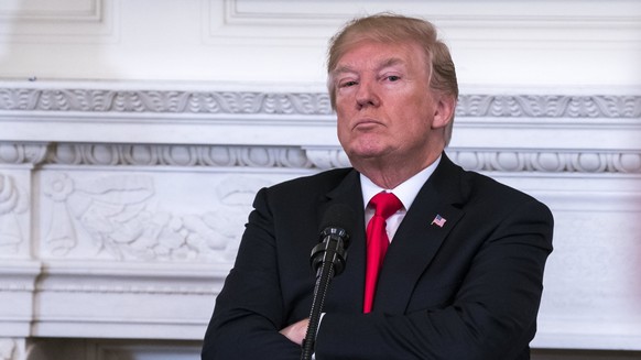 epa06567021 US President Donald J. Trump listens to a statement from Governor of Washington Jay Inslee about ways to combat mass shootings at high schools during a meeting with the nation's gover ...