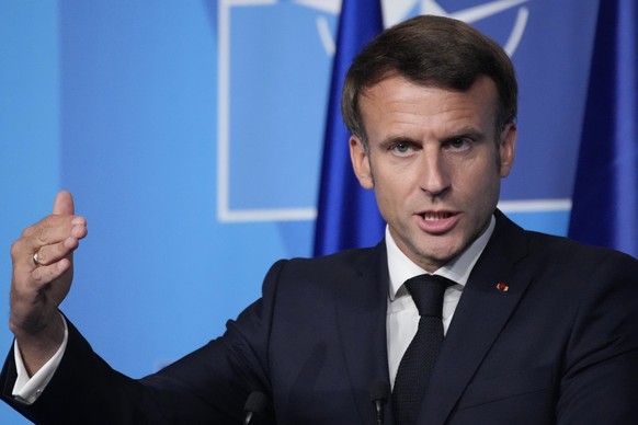 FILE - French President Emmanuel Macron speaks during a press conference after a NATO summit, June 30, 2022 in Madrid. French President Emmanuel Macron arrives in Yaounde, the capital of Cameroon, lat ...