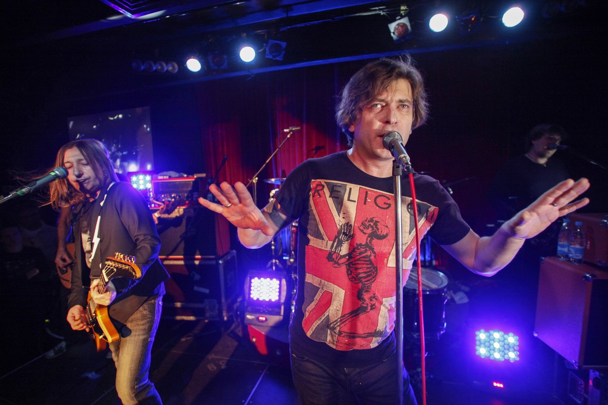 FILE - Aleksandr "Shura" Uman, left, and Yegor "Lyova" Bortnik perform during the Bi-2 rock band concert in Moscow, Russia, Thursday, Dec. 1, 2011. Members of a rock band that has  ...