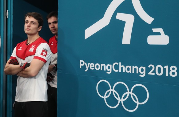 epa06553601 Peter De Cruz (R) and Benoit Schwarz of Switzerland enter the venue for the Men&#039;s semi final game between Sweden and Switzerland at the Gangneung Culring Centre, Gangneung, during the ...