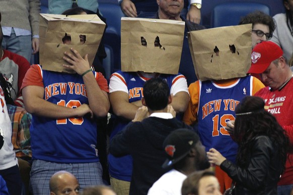 New York Knicks&#039; fans stand during the second half of an NBA basketball game against the New Orleans Pelicans in New Orleans, Tuesday, Dec. 9, 2014. No team has more losses than the Knicks. Only  ...