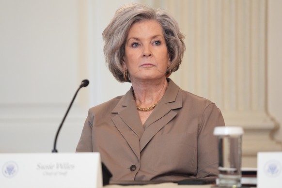 White House chief of staff Susie Wiles listens as President Donald Trump speaks during a roundtable meeting on antifa in the State Dining Room at the White House, Wednesday, Oct. 8, 2025, in Washingto ...