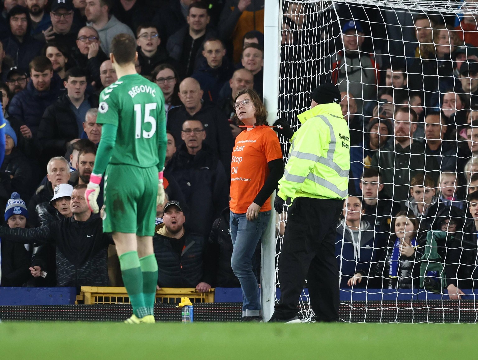 Liverpool, England, 17th March 2022. A protester attaches himself to the goal posts during the Premier League match at Goodison Park, Liverpool. Picture credit should read: Darren Staples / Sportimage ...