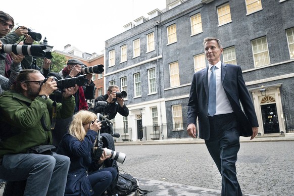 Jeremy Hunt leaves 10 Downing Street in London after he was appointed Chancellor of the Exchequer following the resignation of Kwasi Kwarteng, Friday Oct. 14, 2022. Chancellor of the Exchequer Kwasi K ...