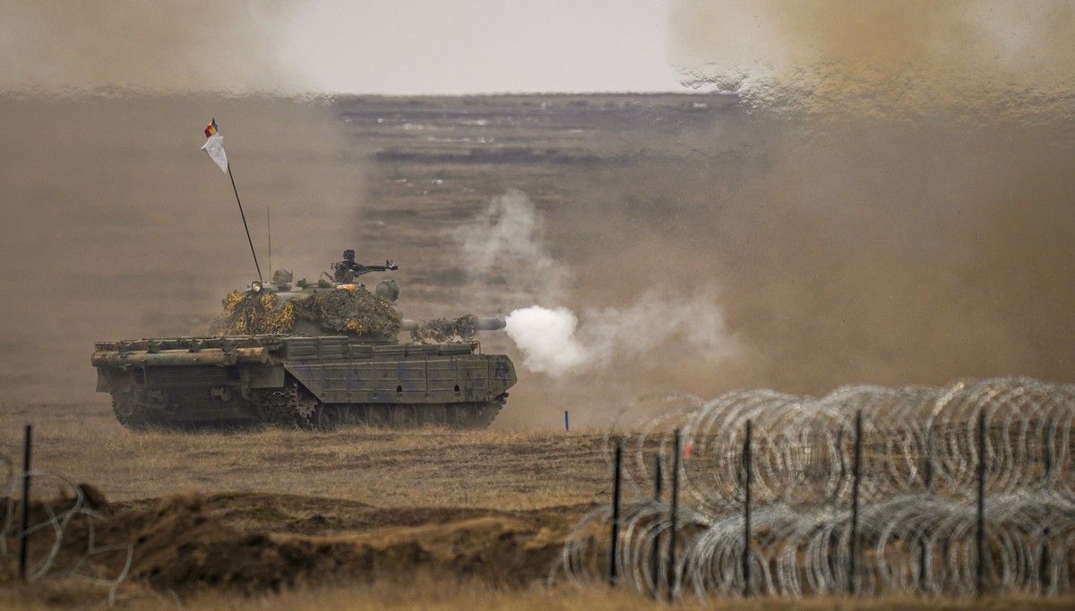 FILE - A tank fires during the Steadfast Dart 2025 exercise, involving multiple nations and representing one of the largest NATO operations planned this year, at a training range in Smardan, eastern R ...