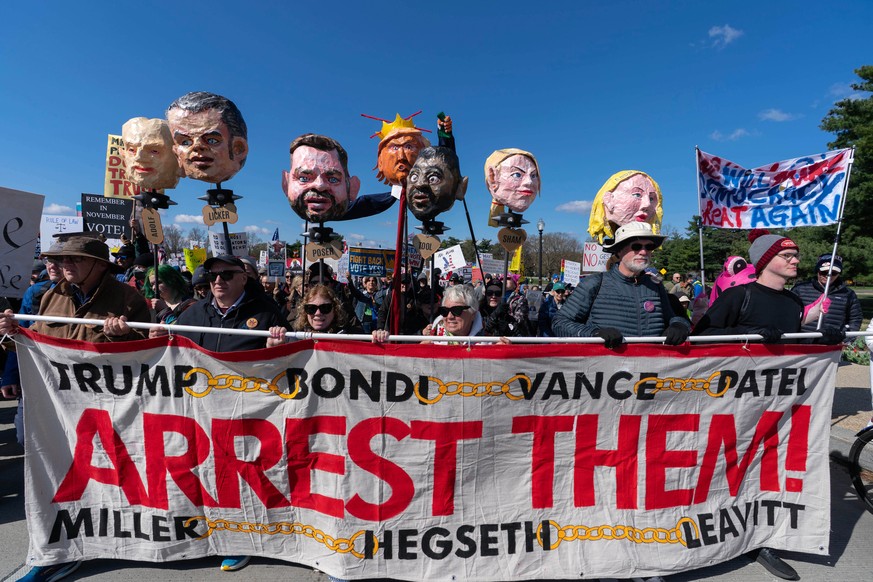 Demonstrators holding up their banners march across the Memorial Bridge during a "No Kings" protest in Washington, Saturday March 28, 2026. (AP Photo/Jose Luis Magana)
No Kings Protest Washi ...