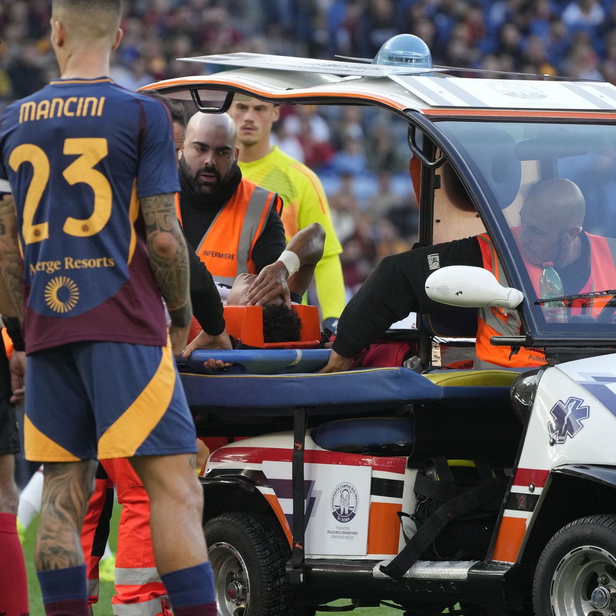 Bologna's Dan Ndoye is taken off the pitch after suffering an injury during the Serie A soccer match between Roma and Bologna at Rome's Olympic Stadium, Sunday, Nov. 10, 2024. (AP Photo/Greg ...