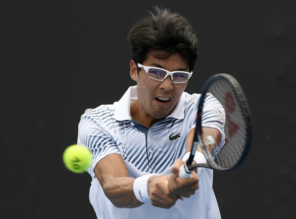 South Korea&#039;s Chung Hyeon makes a backhand return to United States&#039; Bradley Klahn during their first round match at the Australian Open tennis championships in Melbourne, Australia, Tuesday, ...