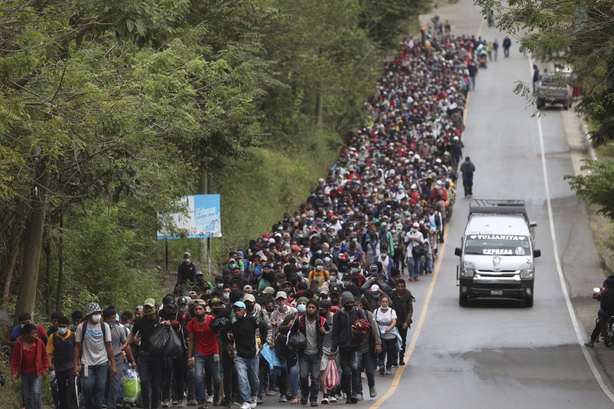 Migrants hoping to reach the U.S. border walk alongside a highway in Chiquimula, Guatemala, Saturday, Jan. 16, 2021. Honduran migrants pushed their way into Guatemala Friday night without registering, ...