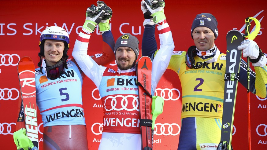 Austria&#039;s Marcel Hirscher, center, winner of an alpine ski, men&#039;s World Cup slalom, celebrates on the podium with second placed Norway&#039;s Henrik Kristoffersen, left, and third placed Swe ...