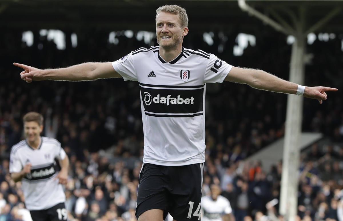 Fulham's Andre Schuerrle celebrates scoring his side's first goal during the English Premier League soccer match between Fulham and Arsenal at Craven Cottage stadium in London, Sunday, Oct.  ...