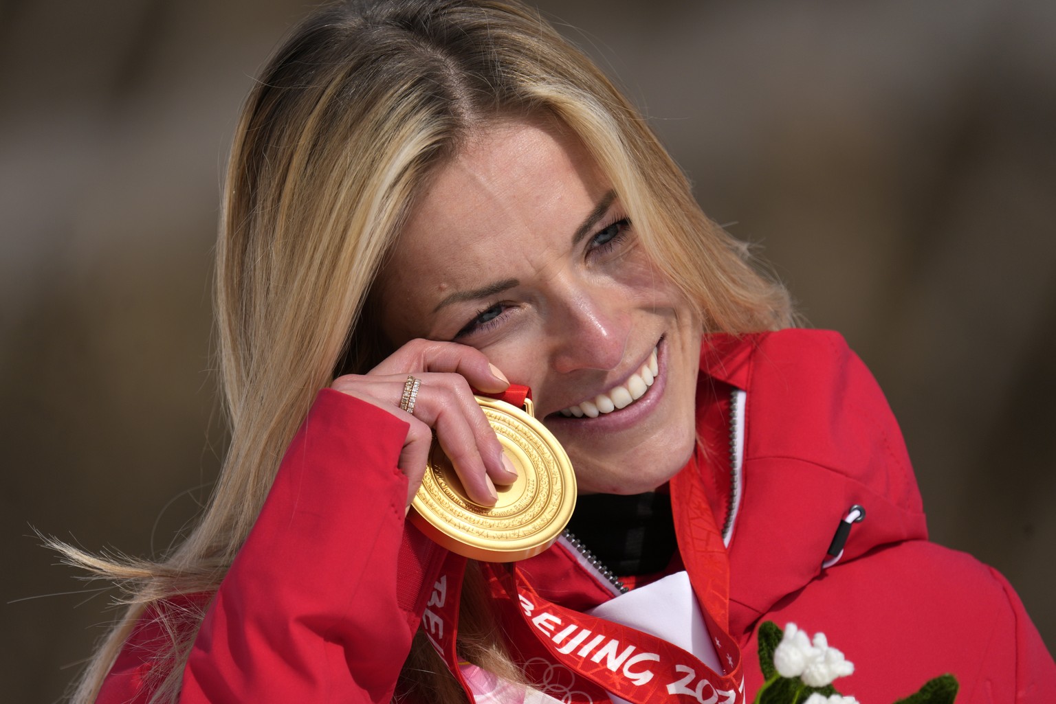 Lara Gut-Behrami, of Switzerland reacts as she celebrates during the medal ceremony after winning the gold medal in the women&#039;s super-G at the 2022 Winter Olympics, Friday, Feb. 11, 2022, in the  ...