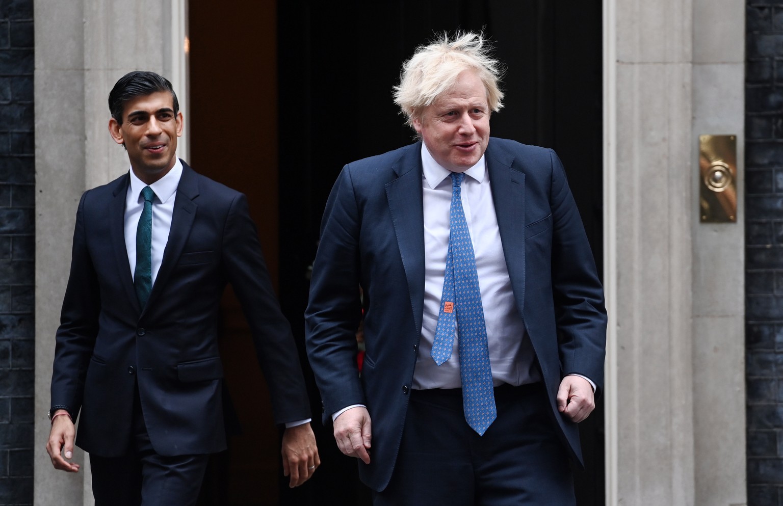 epa09614235 British Prime Minister Boris Johnson (R) with British Chancellor of the Exchequer Rishi Sunak (L), at 10 Downing Street in London, Britain, 01 December 2021. NHS leaders have warned that N ...