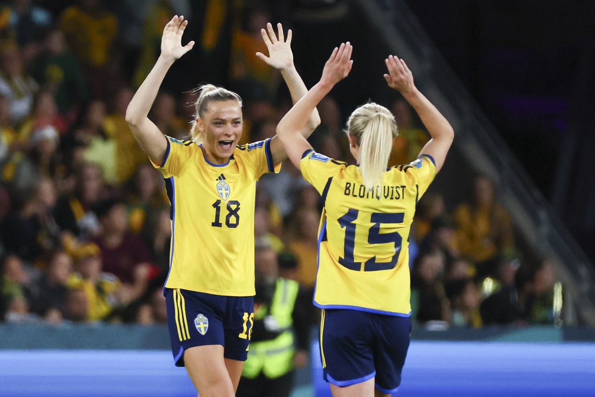 Sweden's Fridolina Rolfo, left, celebrates with teammate Rebecka Blomqvist after defeating Australia in the Women's World Cup third place playoff soccer match in Brisbane, Australia, Saturda ...