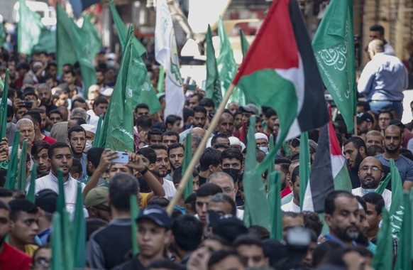 epa09526175 Hamas supporters take part in a protest celebrating the tenth anniversary of the prisoner exchange deal between Hamas and Israel and to show solidarity with prisoners in Israeli jails, at  ...