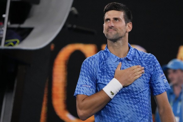 Novak Djokovic of Serbia reacts after defeating Roberto Carballes Baena of Spain in their first round match at the Australian Open tennis championship in Melbourne, Australia, Wednesday, Jan. 18, 2023 ...