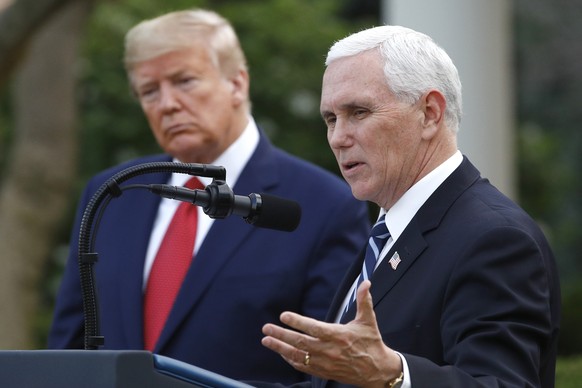FILE - President Donald Trump listens as Vice President Mike Pence speaks during a White House briefing, March 29, 2020, in Washington.  In an interview with Fox News Channel Friday, March 15, 2…