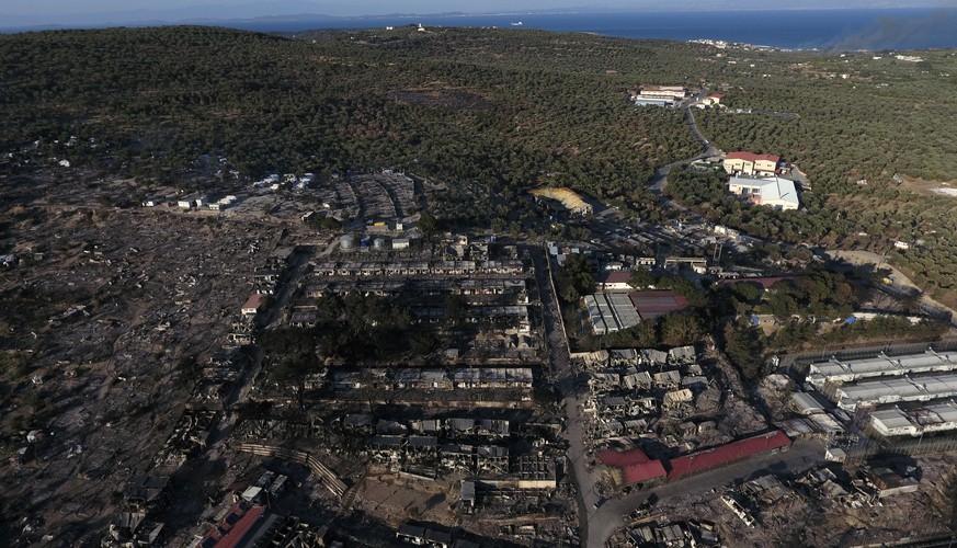 The burned Moria refugee camp is seen from above on the northeastern island of Lesbos, Greece, Thursday, Sept. 10, 2020. Little remained of Greece's notoriously overcrowded Moria refugee camp Thursday ...