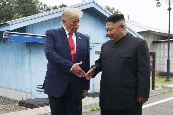 FILE - In this June 30, 2019 file photo, President Donald Trump meets with North Korean leader Kim Jong Un at the border village of Panmunjom in the Demilitarized Zone, South Korea. President Donald T ...