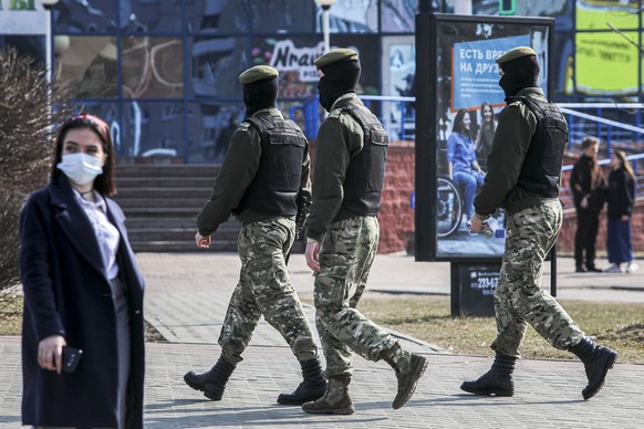 Police patrol a street to prevent an opposition action to protest the official presidential election results in Minsk, Belarus, Saturday, March 27, 2021. Belarusian opposition has urged people to prot ...