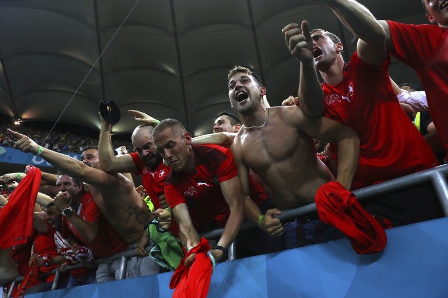 Switzerland fans celebrate end of the Euro 2020 soccer championship round of 16 match between France and Switzerland at the National Arena stadium, in Bucharest, Romania, Tuesday, June 29, 2021. (Mark ...