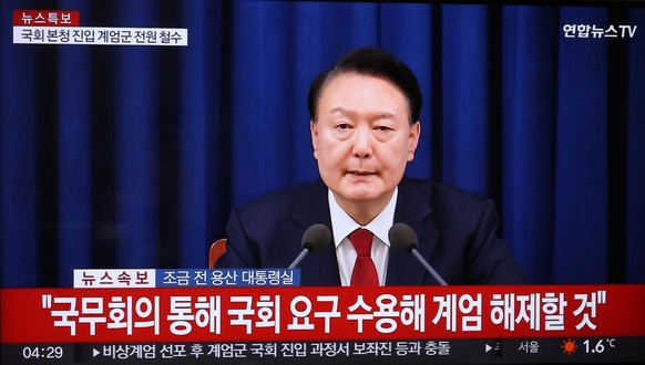 epa11755809 South Korean President Yoon Suk Yeol announces his intention to lift the emergency martial law via a Cabinet meeting in a televised address at the presidential office in Seoul, South Korea ...