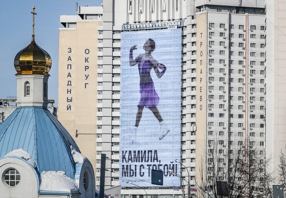 epa09755500 A billboard showing Russia&#039;s Kamila Valieva reads ?Kamila, we are with you!? in Moscow, Russia, 14 February 2022. The 15-year-old Russian Olympic skater, who failed a pre-games drug t ...