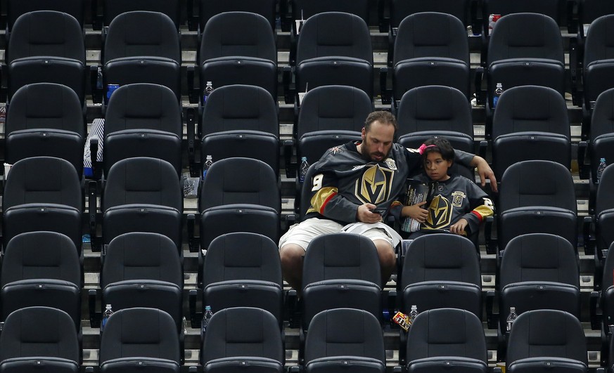 Vegas Golden Knights fans sit as they watch the Stanley Cup ceremony after the Capitals defeated the Golden Knights 4-3 in Game 5 of the NHL hockey Stanley Cup Finals Thursday, June 7, 2018, in Las Ve ...