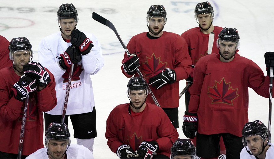 Members of Canada men&#039;s hockey team gather on the ice during a practice session ahead of the 2018 Winter Olympics in Gangneung, South Korea, Friday, Feb. 9, 2018. (AP Photo/Felipe Dana)
