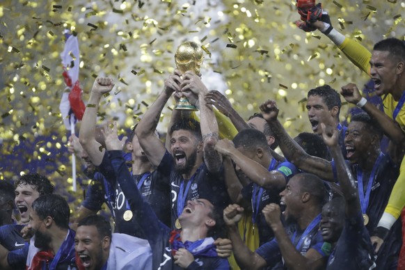 French players celebrates with the trophy after the final match against Croatia at the 2018 soccer World Cup in the Luzhniki Stadium in Moscow, Russia, Sunday, July 15, 2018. (AP Photo/Natacha Pisaren ...