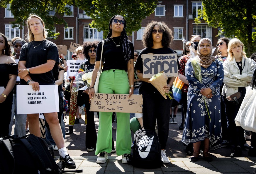 epa10678078 Demonstrators take part in a solidarity protest for Sanda Dia at the Belgian embassy in The Hague, the Netherlands, 07 June 2023. The 20-year-old student died in 2018 during the initiation ...