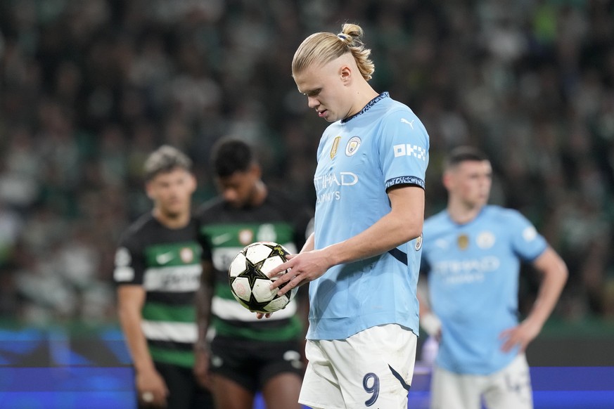 Manchester City&#039;s Erling Haaland prepares to take a penalty kick during the Champions League opening phase soccer match between Sporting CP and Manchester City at the Alvalade stadium in Lisbon,  ...