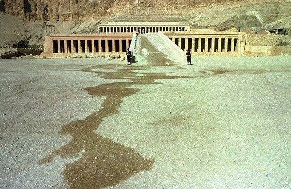 ** FILE ** Two Egyptian soldiers stand guard Tuesday Nov 18, 1997 in front of the temple of Hatshepsut in Luxor, where one day prior 58 tourists were killed by Muslim extremists. (AP Photo/Mohamed El- ...